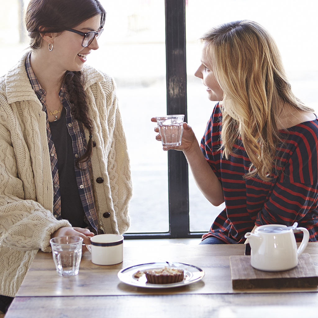 Women talking and a cup of joe